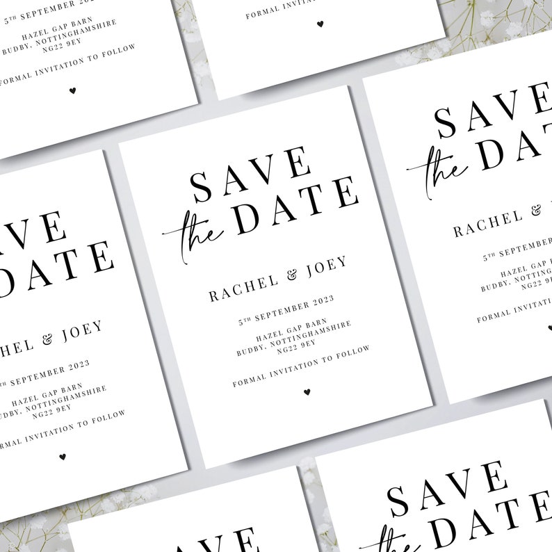May include: White rectangular cards with the text "SAVE the DATE" in a black, elegant font. The cards also include the names "RACHEL & JOEY", date, location, and a small heart. Wedding stationery.