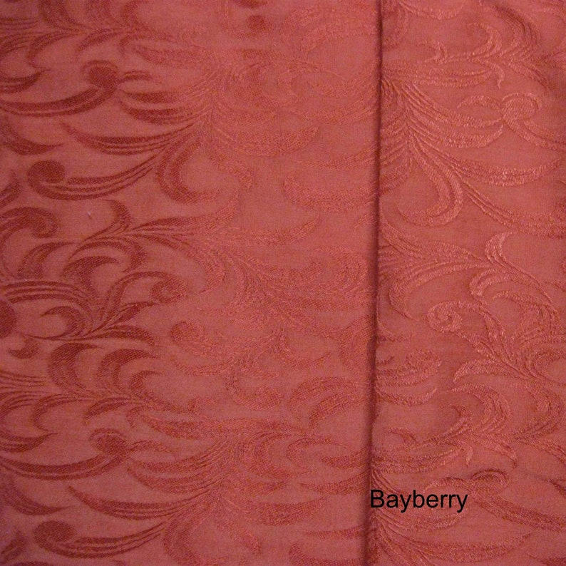 May include: Close-up of a red fabric with a swirling pattern. The fabric has a subtle sheen and a textured surface. The word "Bayberry" is printed in white at the bottom right corner of the image.