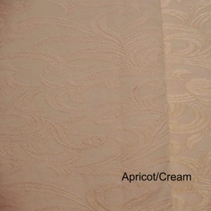 May include: Close-up of fabric with a swirling pattern in apricot and cream colors. The text "Apricot/Cream" is visible in the bottom right corner of the image.
