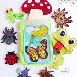 May include: A collection of colorful felt insect and mushroom figures. Includes a red mushroom with white spots, a green grasshopper, a black beetle, a ladybug, a spider, a frog, a dragonfly, a butterfly, a bee, and a cockroach.