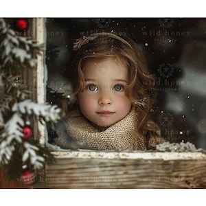May include: A young girl with long brown hair looks out a window with a snowy background. She is wearing a beige knitted scarf and a headband.