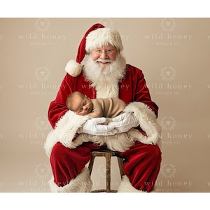 May include: Santa Claus, wearing a traditional red suit with white trim, holds a sleeping baby in his arms. The baby is wrapped in a brown blanket and is wearing a white hat. Santa is sitting on a wooden stool.