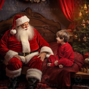May include: Santa Claus in a red suit with a white beard sits on a bed next to a young boy wearing a red pajamas. A decorated Christmas tree is in the background.