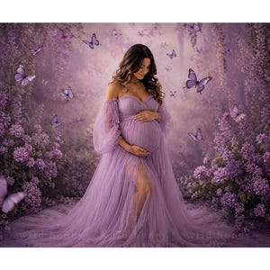 May include: A floor-length lavender maternity gown featuring an off-the-shoulder neckline, sheer long puff sleeves, and a front slit. The dress is made of layered tulle fabric and is surrounded by a digital backdrop of purple flowers and butterflies.