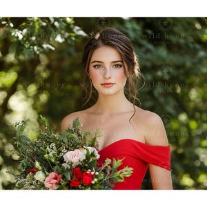 May include: A woman in a red off-the-shoulder dress holds a bouquet of flowers. The bouquet includes red, pink, and white flowers with green foliage. The background is a blurred green.
