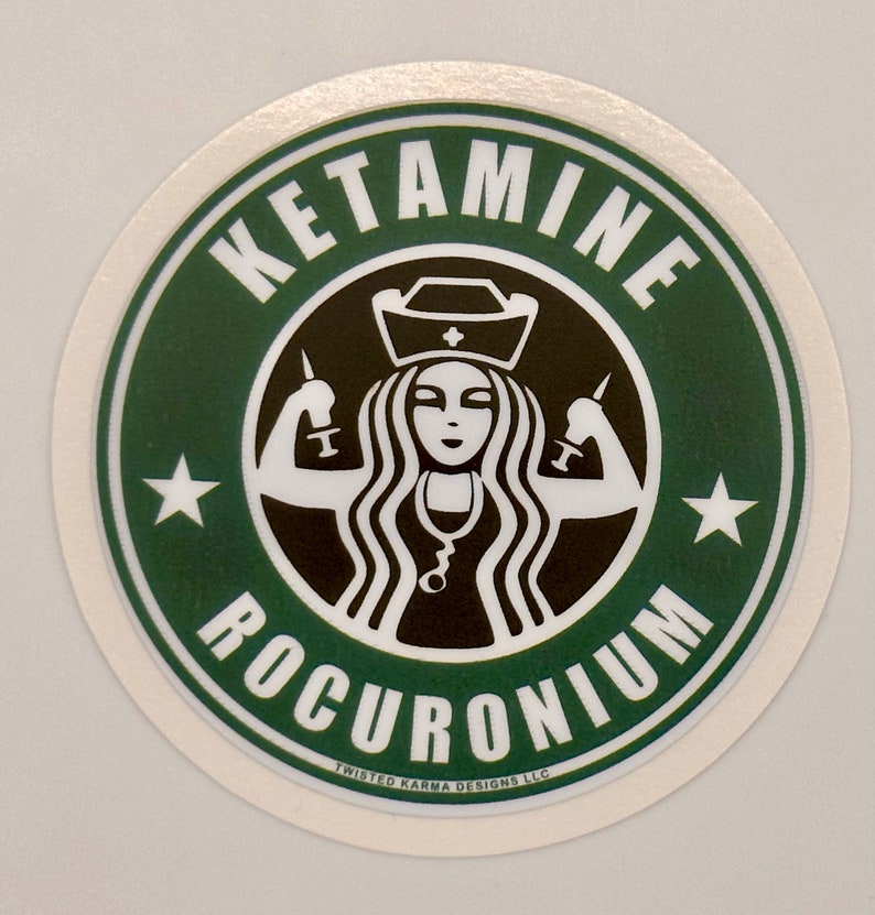 May include: A green and white round sticker with the text "KETAMINE ROCURONIUM" in a black circle. Inside the circle is a black and white illustration of a woman with long hair wearing a nurse's cap and holding syringes in each hand. The text "TWISTED KARMA DESIGNS LLC" is at the bottom of the sticker.