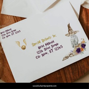May include: A white envelope with a gold and purple stamp featuring a golden snitch and a white owl with a brown hat. The text on the stamp reads "Special Delivery to: Hariet Millenial 1234 Street Sample City Name, ST 12345".