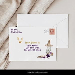 May include: A white envelope with a gold and purple design featuring a golden snitch and an owl wearing a black and gold wizard hat. The envelope has a stamp and the text "Special Delivery to: Hariet Millenial 1234 Street Sample City Name, ST 12345" printed on it.