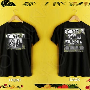 May include: Black t-shirt with a white graphic print of the band "Grey Day" and the text "Tour Dates". The back of the shirt features a larger graphic print of the band members and tour dates.