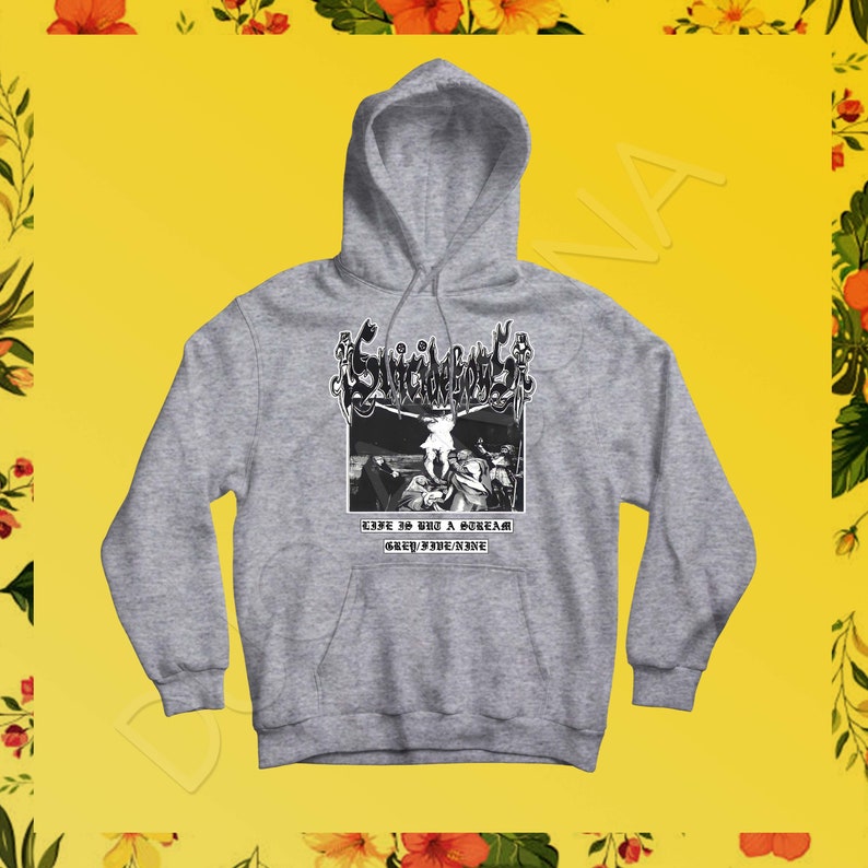 Peut inclure: Un sweat &agrave; capuche gris avec un imprim&eacute; graphique noir et blanc d'un groupe appel&eacute; "Suicide Boys". Le graphique repr&eacute;sente un cr&acirc;ne avec une couronne et le texte "Life is but a dream Grey/Fade/Nine".