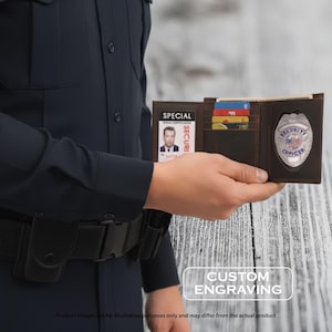 May include: A brown leather security officer badge holder with a badge, ID card, and slots for cards. The badge is silver with a blue and red design. The ID card has a photo and the word "SPECIAL" is printed on the holder.
