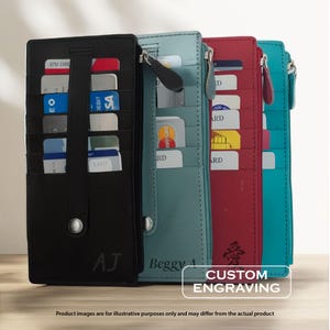 May include: A collection of colorful leather card wallets in black, teal, red, and turquoise. Each wallet features multiple card slots and a zipper closure. The black wallet has the initials "AJ" engraved. The image includes the text "CUSTOM ENGRAVING".