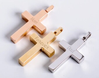 May include: Three metal cross pendants in rose gold, gold, and silver. The rose gold cross is engraved with "Mom", the gold cross with "Forever", and the silver cross with "Dad". Each cross has a small loop at the top for a chain.