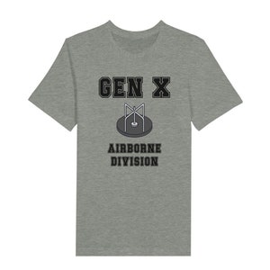 Bella Canvas 3001 T-Shirt with  the words generation X in black graphics a photo of a vintage play ground round and round and the words airborne division underneath in black graphics. The TShirt is athletic heather grey