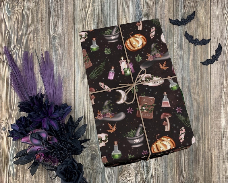 May include: Black and brown wrapping paper with a witchy theme. The paper features a repeating pattern of potion bottles, a witch's hat, a cauldron, a book, a pumpkin, and other witchy elements.