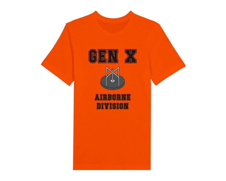 Bella Canvas 3001 T-Shirt with  the words generation X in black graphics a photo of a vintage play ground round and round and the words airborne division underneath in black graphics. The TShirt is orange