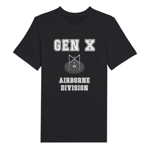 Bella Canvas 3001 T-Shirt with  the words generation X in white graphics a photo of a vintage play ground round and round and the words airborne division underneath in white graphics. The TShirt is black.