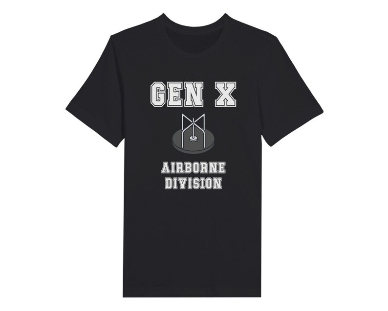 Bella Canvas 3001 T-Shirt with  the words generation X in white graphics a photo of a vintage play ground round and round and the words airborne division underneath in white graphics. The TShirt is black.