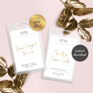 May include: Two wax melt labels with gold text on a white background. The labels are in clear plastic packaging. The first label says "Burnt Orange & Berries" and the second label says "Vanilla & Cacao Seeds". Both labels have the text "Business Name Here" and "Hand-poured Scented Wax Melts" and "Made in California".