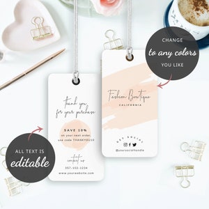 May include: A white gift tag with a pink watercolor design and the text "Fashion Boutique California". The tag also includes the text "Thank you for your purchase", "Save 10% on your next order, use code THANKYOU10", "Contact us 357-102-1234", and "www.yourwebsite.com".