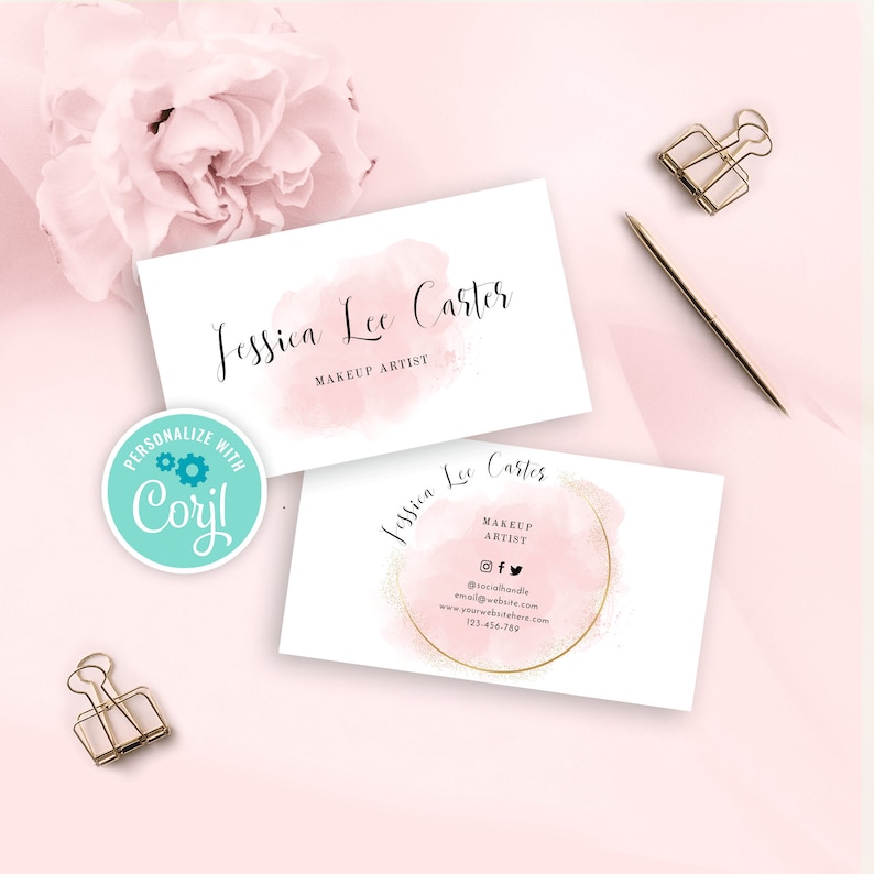 May include: Two pink and white business cards with a watercolor design and gold glitter accents. The text on the cards reads "Jessica Lee Carter Makeup Artist" and includes social media handles, an email address, a website address, and a phone number.