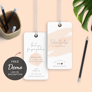 May include: Two white hang tags with a pink watercolor design. The top tag says "Fashion Boutique California" and the bottom tag says "Thank you for your purchase. Save 10% on your next order, use code THANKYOU10. Contact us 357-102-1234 www.yourwebsite.com".
