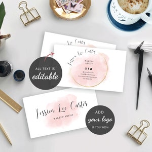 May include: Two pink and gold business cards with a watercolor design. The text on the cards reads "Jessica Lee Carter, Makeup Artist". The top card includes social media icons, an email address, a website address, and a phone number. The bottom card has the text "ADD your logo IF YOU WISH".