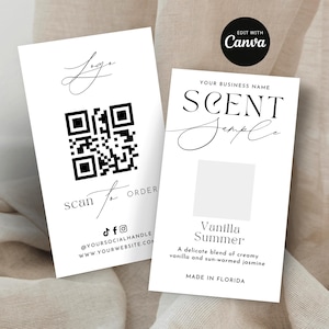 May include: Two white business cards with black text. One card has a QR code and the words "scan to order". The other card says "Scent Sample" and "Vanilla Summer". The cards are on a neutral background.