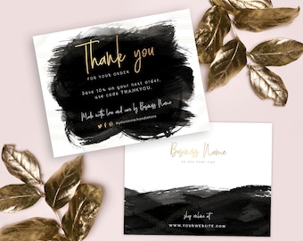 May include: Black and white thank you card with gold text. The card says "Thank you" and includes a discount code for the next purchase. The card also includes the business name and social media handles.