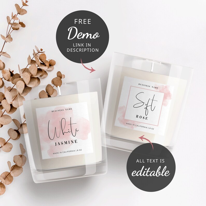 May include: Two candle jars with labels. The labels are white with a pink watercolor background. The text on the labels reads "White Jasmine" and "Soft Rose". Both labels say "Made in California | 8 oz".