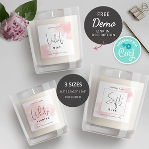 May include: Three candle jars with labels featuring watercolor-style pink backgrounds and handwritten text. The labels read "Velvet Mist", "White Jasmine", and "Soft Rose". Each label includes the text "Business Name" and "Made in California 8 oz". The text "3 Sizes 2x2" | 2.5x2.5" | 3x3" Included" is also visible.