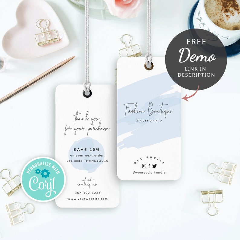 May include: Two white gift tags with blue watercolor accents. The top tag says "Fashion Boutique, California" and has social media icons. The bottom tag says "Thank you for your purchase" and has a discount code offer. Both tags have a hole for string.