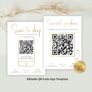 May include: Two white signs with gold text and a gold-colored QR code. The text on the signs reads "Scan to shop" and "Scan with your phone". The signs are for a business called "Courtney's Boutique".