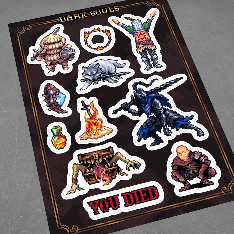 May include: A set of Dark Souls video game themed stickers featuring characters, items, and the iconic "You Died" message. The stickers are printed on white paper with black outlines.