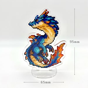 May include: A pixelated dragon figurine, 3.7 inches tall and 2.6 inches wide, stands on a clear base. The dragon features blue, orange, and yellow hues. The design is reminiscent of retro video game graphics.