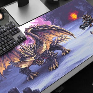 May include: Large rectangular mouse mat with a pixelated dragon design in gold, brown, and purple hues. The image includes other pixelated creatures and a fiery background. A keyboard and speaker are visible.