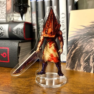 Acrylic standee of Pyramid Head from Silent Hill 2 drawn in a pixel art style.