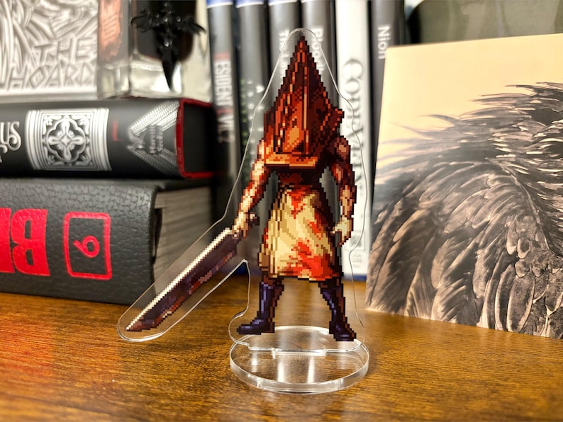 Acrylic standee of Pyramid Head from Silent Hill 2 drawn in a pixel art style.
