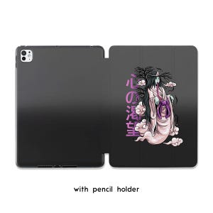 May include: Black iPad case with a wraparound design featuring a Japanese ghost illustration in white, pink, and purple. The case includes the text "with pencil holder".