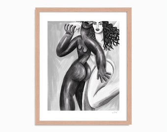 May include: A framed black and white art print featuring a stylised illustration of two figures with contrasting skin tones. One figure is dark-toned and positioned in the foreground, while the other is light-toned with dark curly hair behind it.