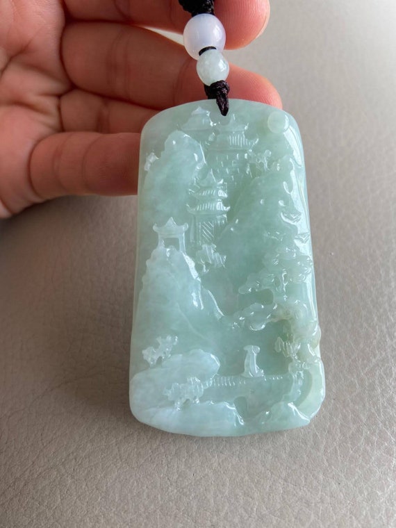 Carved jadeite pendant best sale