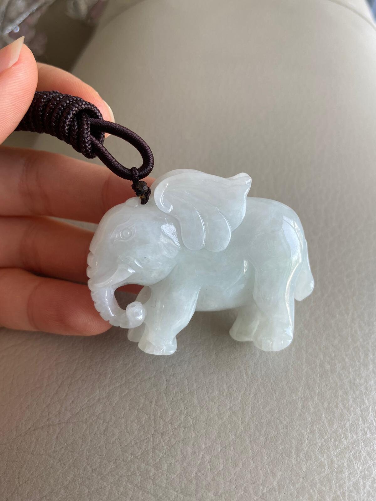 White jade elephant best sale pendant