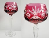 Rare Nachtmann hand cut to clear cranberry lead crystal wine glass. Vintage German bohemian coloured crystal wine glass with starburst.