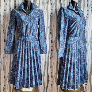 Fabulous 1970s vintage boho dress. Mid length pleated skirt collared dress with a bright blue paisley pattern. 70s dress. UK size 12