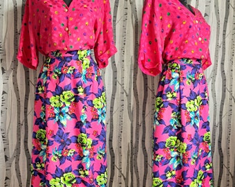 Bright vintage 1980s multicoloured skirt with an eye-popping bright flower pattern. Midi length 80s skirt with pockets. Size 8/10