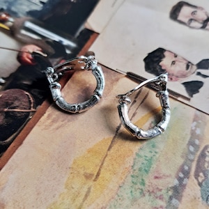 Unusual silver tone clip on earrings in the shape of twigs. 1980s vintage wood texture hoop earrings for UN-pierced ears.