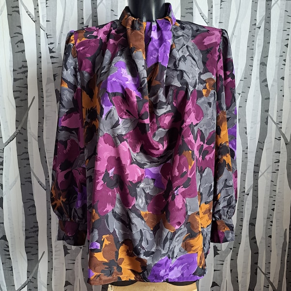 Vintage early 80s purple and orange floral blouse with an unusual scarf style collar and loose sleeves. 1980s patterned shirt. UK size 16/18