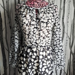 Vintage 1970s long sleeved black and white tiered maxi dress. Monochrome leaf print 70s maxi dress. UK size 12