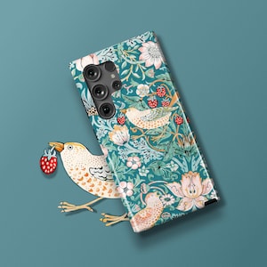 May include: A teal blue phone case with a floral pattern featuring birds and strawberries. The case has a cutout for the camera lens.