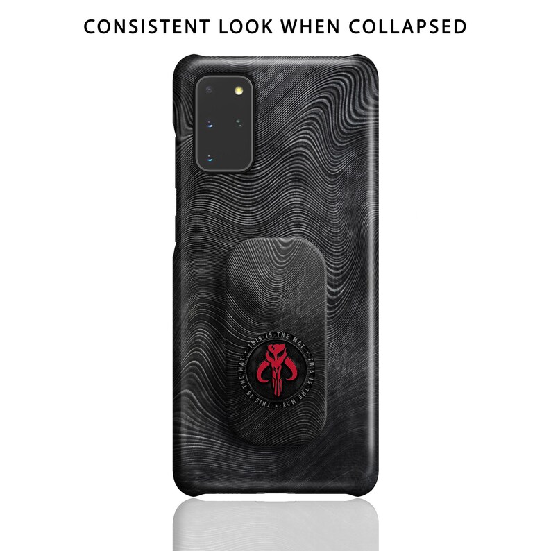 May include: Black phone case with a textured wood grain pattern and a circular Mandalorian symbol with the text "This is the way" in red. The case has a built-in pop socket.